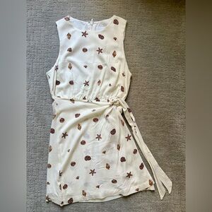 NWOT Sugarlips Size Large Sleeveless Cream Tie-Waist Shell Print Dress.
